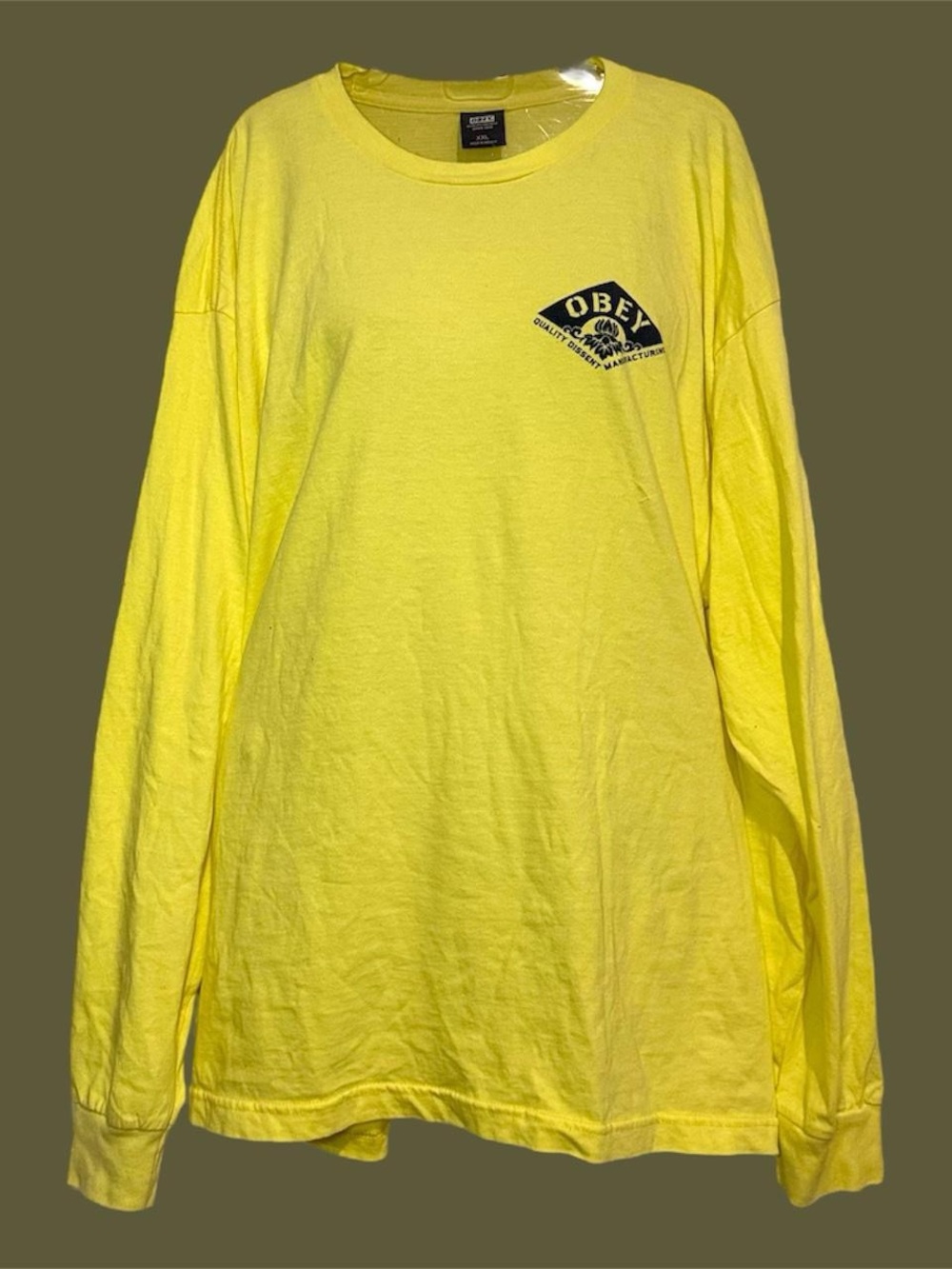 Men’s yellow obey long sleeve shirt.
